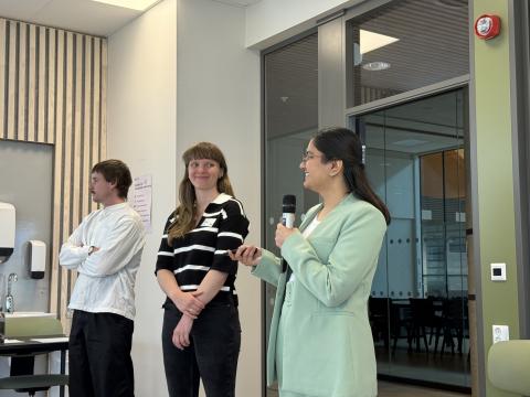 three persons presenting